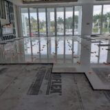 Luxury large-format marble floor installation in modern waterfront home, Naples Florida floor remodeling services.