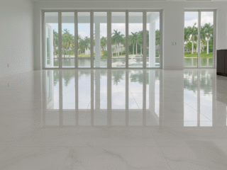 Luxury large-format marble floor installation in modern waterfront home, Naples Florida floor remodeling services.